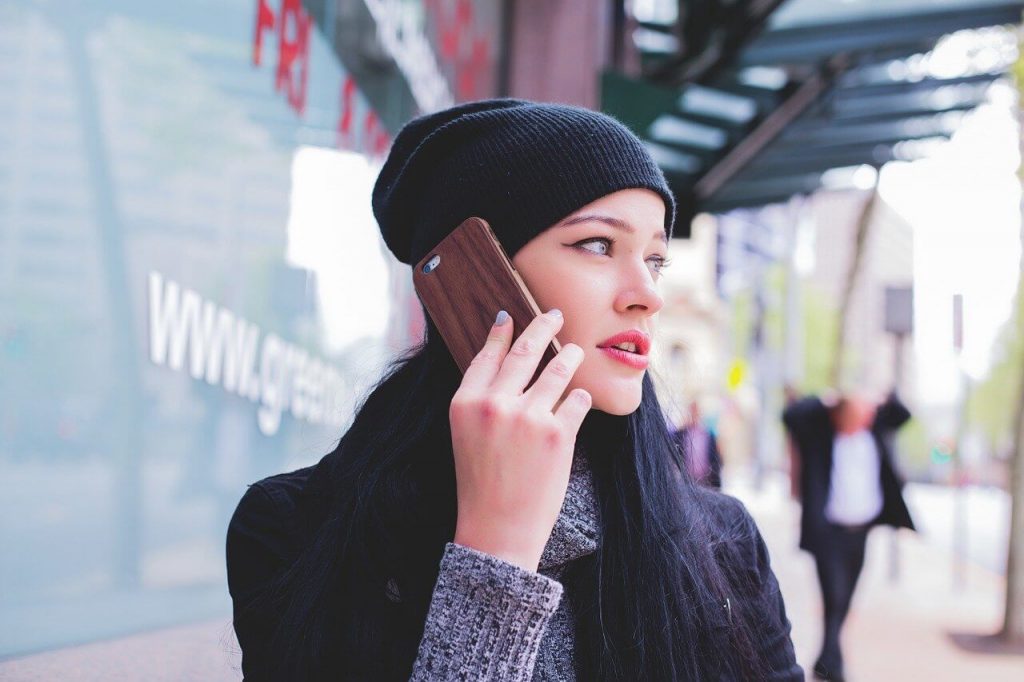 reverse phone look up by a worried person talking on the phone